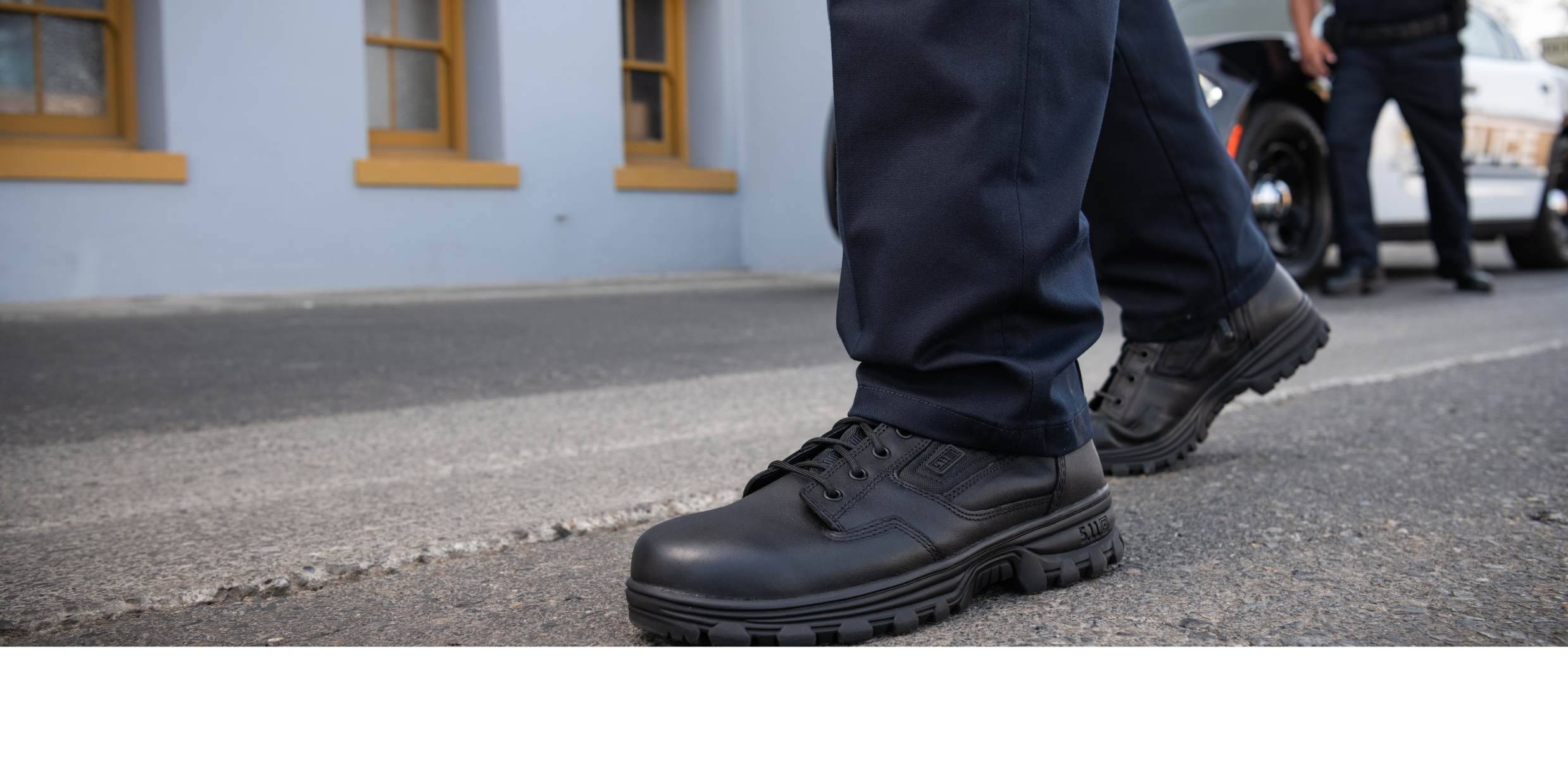 Cop Walking in tactical boots close up