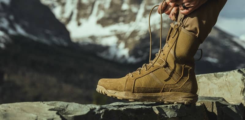 Man Tying tactictal boot shoelace