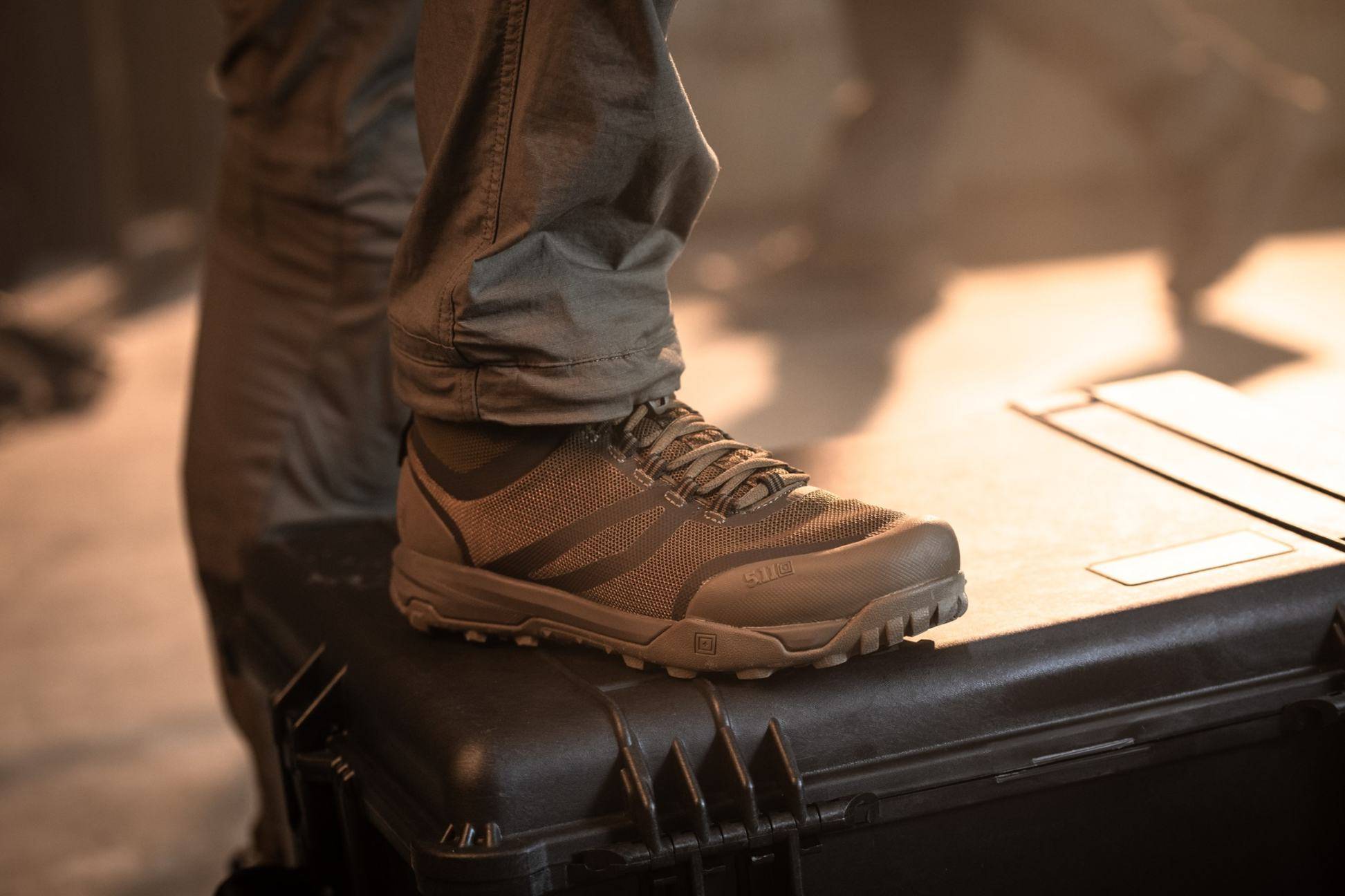 Person showing off side profile of tactical boots