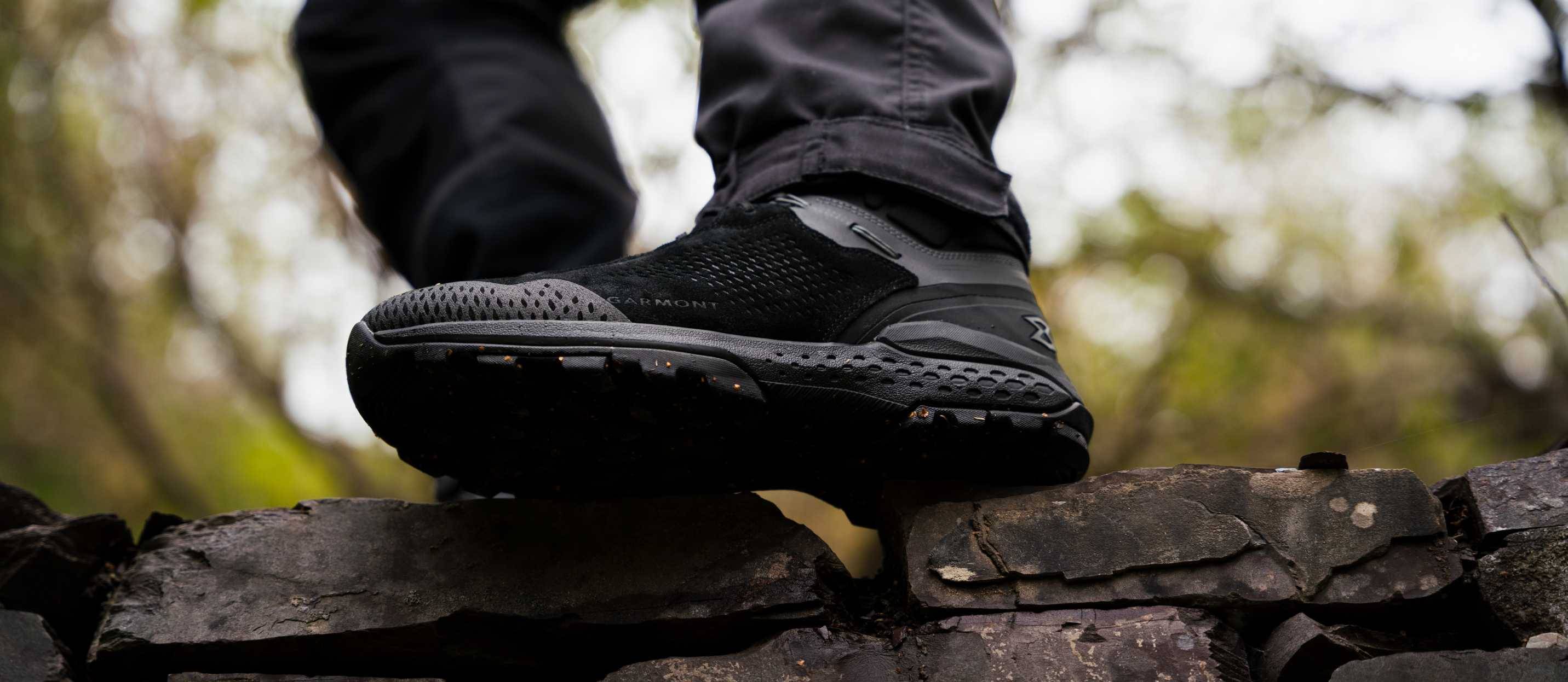 Person wearing Garmont tactical boots standing on bricks